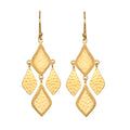 Adorned with Light Chandelier Earrings, featuring hammered 18kt gold plate petals that shimmer in the light. These elegant earrings embody the essence of spiritual jewelry, perfect for meditation and as a meaningful talisman for manifestation. Ideal for yoga enthusiasts and those seeking protection, their design resonates with the sun and moon's energy, making them a perfect addition to any zodiac-inspired collection.