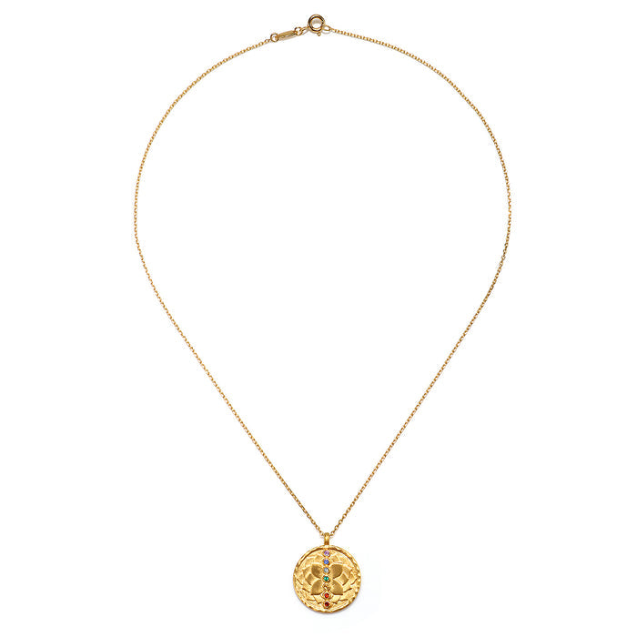 The Aligned in Purpose Chakra Necklace displayed elegantly, featuring its intricate design. This piece represents spiritual jewelry that supports meditation practices, mantra, and yoga. Its meaningful and symbolic attributes create a protective aura, serving as a sacred amulet for manifestation and zodiac spirits.