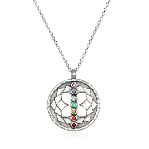 Divine Alignment Gemstone Chakra Silver Necklace featuring a hand-etched lotus relief, showcasing seven vibrant gemstones representing the chakras. This spiritual jewelry is an ideal meditation gift, embodying meaningful symbolism for yoga practitioners, and serves as an amulet for manifestation and protection. Its sacred design holds significance for zodiac enthusiasts, making it a perfect addition to any collection.