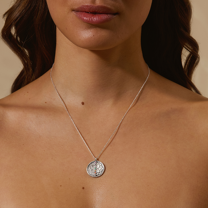 A model wearing the Divine Alignment Gemstone Chakra Silver Necklace, showcasing its beauty designed for spiritual jewelry and meditation gifts that symbolize personal growth and meaningful energy alignment for yoga and manifestation.
