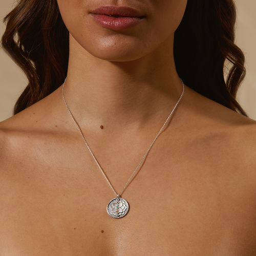 A model wearing the Divine Alignment Gemstone Chakra Silver Necklace, showcasing its beauty designed for spiritual jewelry and meditation gifts that symbolize personal growth and meaningful energy alignment for yoga and manifestation.