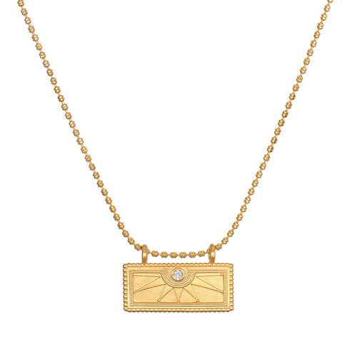 April White Topaz Sunburst Birthstone Tablet Necklace featuring a radiant sunburst design and white topaz, symbolizing individuality and creativity. This spiritual jewelry piece embodies the essence of meditation and serves as a meaningful talisman for protection and manifestation, perfect for yoga enthusiasts.
