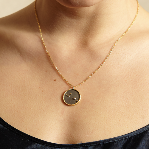 Aquarius Zodiac Necklace worn elegantly, highlighting the pendant with an artistic design representing the zodiac sign, an ideal choice for spiritual jewelry and meditation gifts. This meaningful piece acts as a protective amulet, emphasizing the significance of zodiac energy.