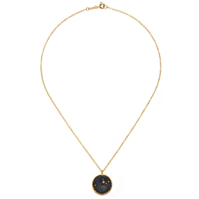 Elegant Aquarius Zodiac Necklace with a dark stone pendant, created by Satya Jewelry. This piece of spiritual jewelry serves as a meaningful symbol for those practicing yoga, meditation, and seeking protective charm for spiritual enhancement.