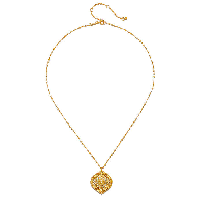 Close-up shot of the Awaken Awareness Lotus White Topaz Necklace featuring a detailed pendant, highlighting its charm and significance in meditation and spiritual practices.