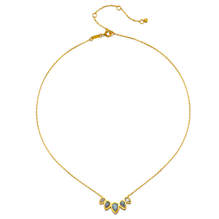 Close-up of the Awaken Intuition Labradorite Petal Necklace, highlighting its delicate design and labradorite stones. This stunning piece of spiritual jewelry embodies meaning and is a perfect talisman for manifestations, meditation, and connecting with the sun and moon.