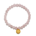 Awaken Love Mandala Rose Quartz Gemstone Bracelet featuring faceted rose quartz beads and a golden mandala charm, embodying spiritual jewelry ideals of love and compassion, perfect for meditation and as a talisman for meaningful manifestations in yoga and zodiac practices.
