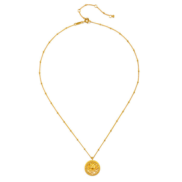 The Intention of Infinite Potential Necklace Set displayed elegantly, with the gold lotus pendant as a focal point. A beautiful addition to spiritual jewelry collections aimed at enhancing meditation and personal growth.