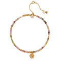 Bloom On Your Path Pink Tourmaline Lotus Bracelet showcasing a delicate lotus pendant with pink tourmaline and topaz beads, symbolizing new beginnings and transformation. This piece of spiritual jewelry is perfect for meditation and is a meaningful talisman for those practicing yoga and manifestation while embracing the energy of the sun and moon.