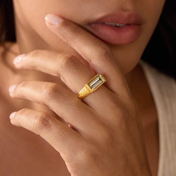 A model wearing the Blooming Splendor Lotus Green Amethyst Ring on her hand, highlighting its unique design and spiritual significance, complementing her meditation practice. The ring symbolizes protection and meaningful transformation in her journey.