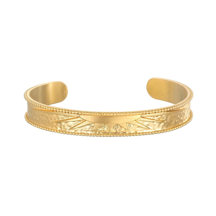 Breaking Dawn Sunrise Cuff bracelet showcasing an elegant etched sunrise design, perfect for spiritual jewelry and meditation. This 18kt gold plated cuff embodies the sun's energy, making it a meaningful talisman for yoga and manifestation.