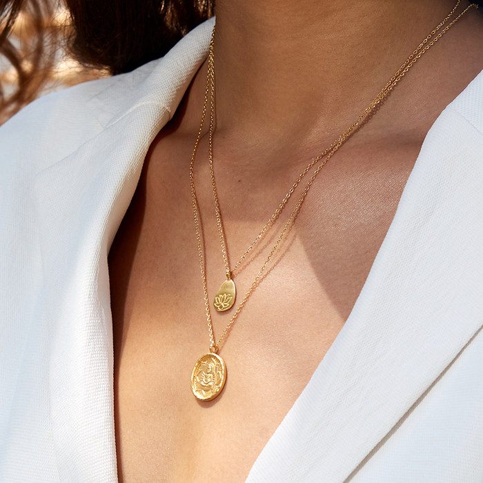 Layered view of Buddha, Inner Peace Necklace featuring a Buddha pendant along with an additional charm. This spiritual jewelry duo represents tranquility and mindfulness, great for meditation and yoga. A meaningful talisman that encourages protection and fosters a connection to spirituality.