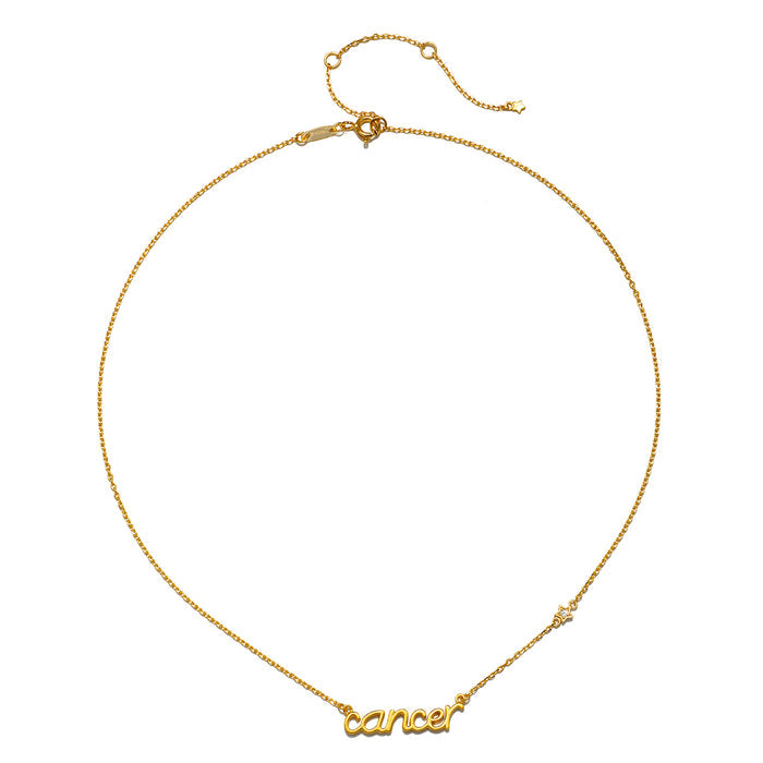 Close-up of the Cancer Nurture Zodiac Script Necklace featuring a gold chain and the word 'cancer'. This elegant piece embodies spiritual jewelry that promotes protection and meaningful manifestation, making it a perfect addition to any yoga or meditation routine.