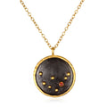 The Capricorn Zodiac Necklace featuring a unique circular pendant adorned with a red garnet stone, symbolizing leadership and abundance. This spiritual jewelry is perfect for meditation gifts, mantra practice, and yoga. Its meaningful design serves as a protective amulet, offering a sacred connection to the Capricorn zodiac sign and its manifestation of personal strength.