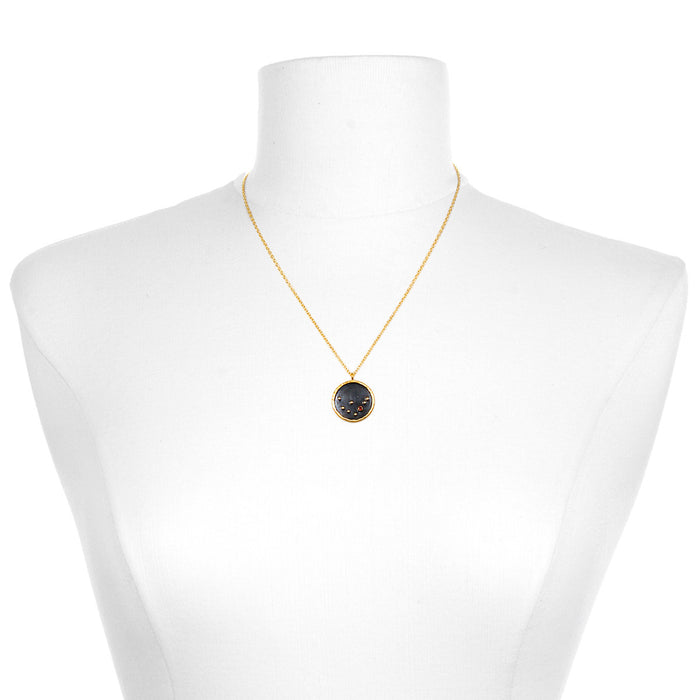 The Capricorn Zodiac Necklace displayed on a mannequin, highlighting its delicate chain and pendant. This symbolic jewelry serves as a protective amulet for meditation, bringing forth the energies of the zodiac in a meaningful way.