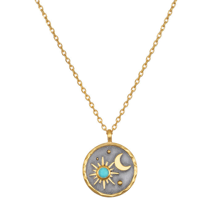 Celestial Birthstone Necklace - December featuring a sun and moon design with turquoise accent. This spiritual jewelry piece symbolizes health and self-expression, making it a meaningful talisman for yoga and meditation practices.