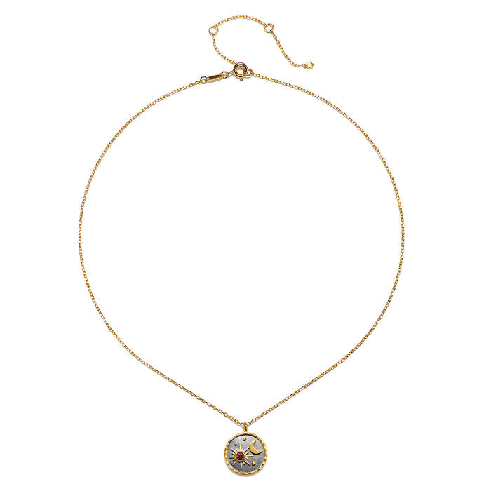 Celestial Birthstone Necklace - January displayed on a white background, featuring a gold chain and an intricately designed pendant with sun and moon elements, ideal for spiritual jewelry and meditation, symbolizing protection and meaning.
