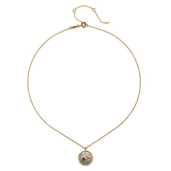 Celestial Birthstone Necklace - July featuring a ruby accent symbolizing passion and integrity, set against a gunmetal background in 18kt gold plate. This spiritual jewelry piece embodies meaning and is perfect for meditation and manifestation, representing the sun and moon in a zodiac-inspired design.