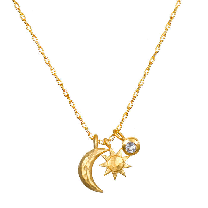 Gold-toned necklace with chain featuring moon, sun, and crystal pendant charms.