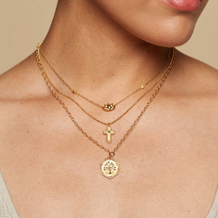 Stacked necklaces with the Centered in Faith Cross Gold Necklace highlighted, showcasing spiritual jewelry that symbolizes devotion and charm for yoga and manifestation.