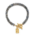 Chasing Dreams Labradorite Celestial Bracelet featuring labradorite beads and an 18kt gold plate moon charm, symbolizing spiritual jewelry for meditation and meaningful manifestation.