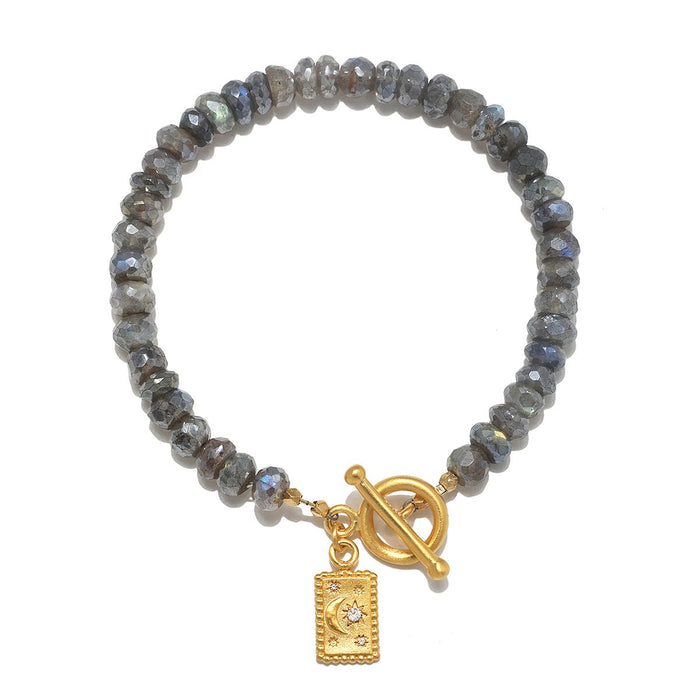 Chasing Dreams Labradorite Celestial Bracelet featuring labradorite beads and an 18kt gold plate moon charm, symbolizing spiritual jewelry for meditation and meaningful manifestation.