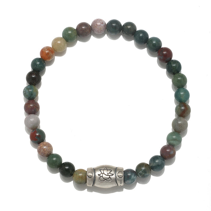 Coming Into Focus Men's Fancy Jasper Bracelet featuring smooth round fancy jasper beads and a silver Ganesha charm, embodying spiritual jewelry perfect for meditation and meaningful practices. This bracelet serves as a talisman for zodiac signs, enhancing focus and creativity while offering protection and grounding in spiritual activities like yoga and manifestation under the sun and moon.
