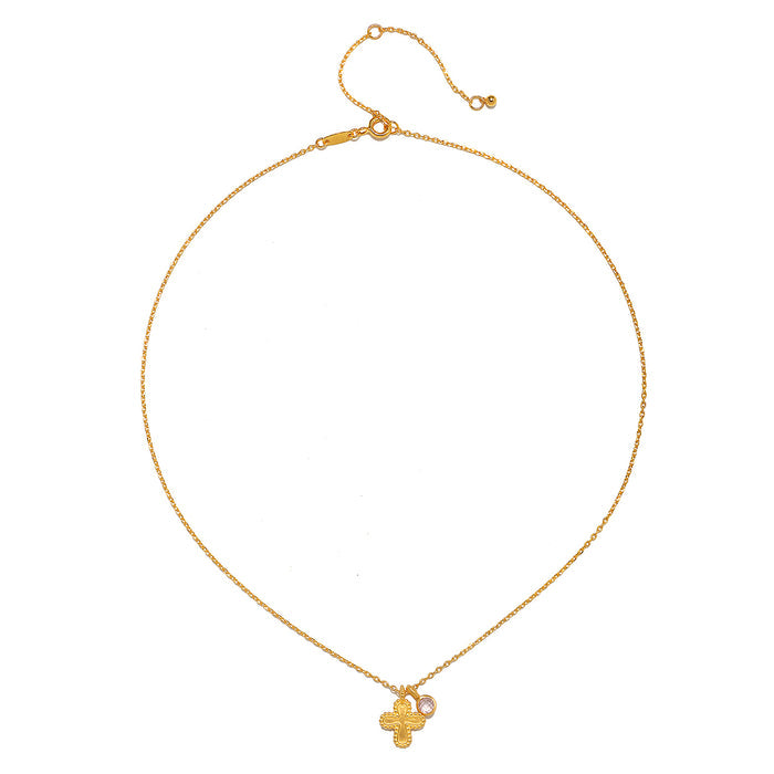A close-up view of the Compassionate Faith Rose Quartz Cross Necklace, displaying the detailed craftsmanship of the gold plated cross and the beautiful rose quartz charm, ideal for yoga and zodiac enthusiasts.