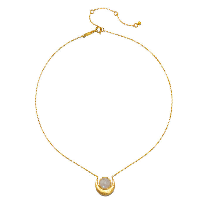 Cradled in Light Moonstone Necklace featuring an 18kt gold plated crescent moon with a luminous orb of moonstone. This spiritual jewelry embodies qualities of intuition and protection, making it a meaningful talisman for meditation or yoga practices. Perfect for those who seek to connect with their zodiac or manifest good fortune through the energies of the sun and moon.