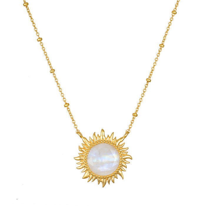 Gold-tone necklace with a sun-shaped pendant featuring a white iridescent moonstone center and beaded chain.