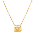 Dawn of Renewal Lotus Necklace featuring an intricate lotus flower engraved on a delicate rectangular pendant, symbolizing new beginnings. This spiritual jewelry piece is perfect for meditation, serving as a talisman for manifestation and meaningful protection during yoga practice.
