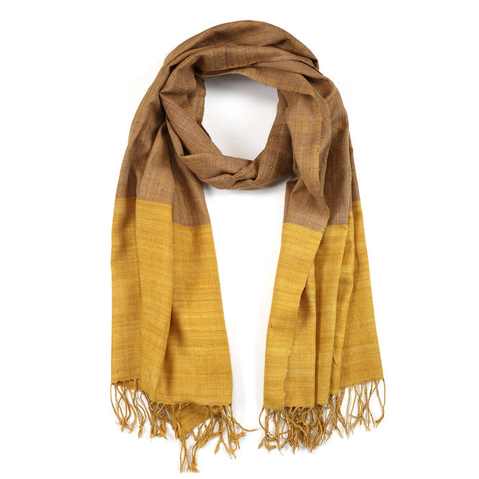 Dhora Silk Scarf by Yarn Glory, featuring a beautiful combination of turmeric and teak tree leaf dyes, symbolizing spiritual protection and meaningful elegance. Perfect for yoga and meditation practices, this scarf embodies the essence of charm and manifestation with its hand-spun texture.