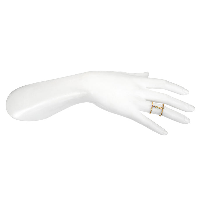 The Divine Alignment Chakra Adjustable Ring displayed on a white mannequin hand, emphasizing its adjustable design crafted from 18kt gold plate, making it a beautiful addition to yoga and mantra practices, offering protective and sacred energy.