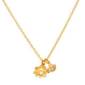 Gold chain necklace with two lotus flower pendants, one with textured petals and one smaller with a crystal accent.