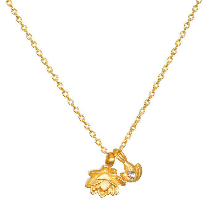 Gold chain necklace with two lotus flower pendants, one with textured petals and one smaller with a crystal accent.