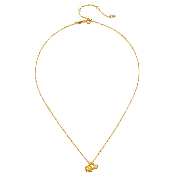 Gold-toned chain necklace with two small lotus flower pendants at the bottom and adjustable clasp closure.