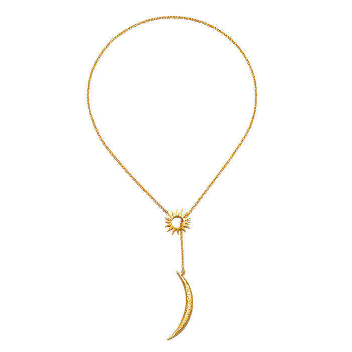 The Dreams Celestial Sun and Moon Lariat Necklace displayed elegantly against a simple background. This spiritual piece, featuring the sun and moon, embodies protection and is ideal for those interested in meaningful jewelry related to meditation, talismans, and zodiac energy.