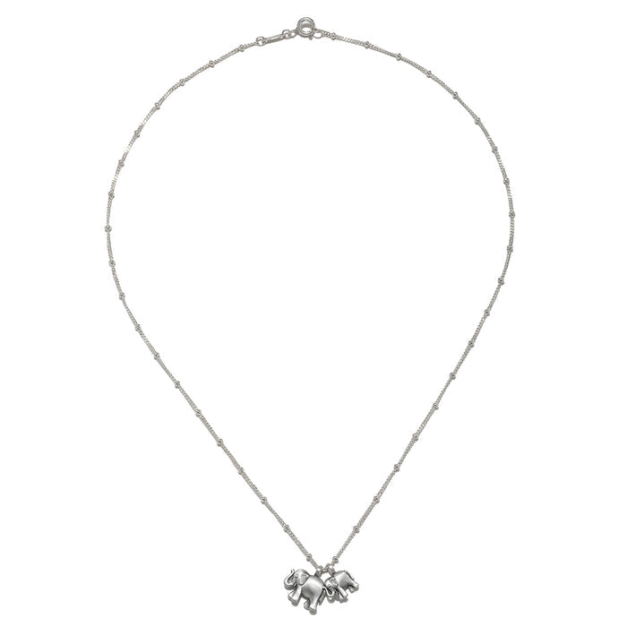 The Elephant Love Silver Necklace displayed elegantly on a flat surface, showcasing its detailed craftsmanship. This spiritual jewelry serves as a talisman for love and good fortune, ideal for those seeking meaningful accessories for meditation.