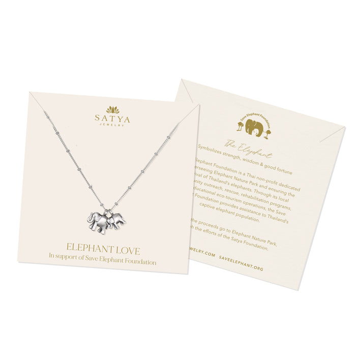 The presentation card for the Elephant Love Silver Necklace, explaining its connection to the Save Elephant Foundation. This piece embodies the spirit of spiritual jewelry, offering protection and meaningful support for the cause.