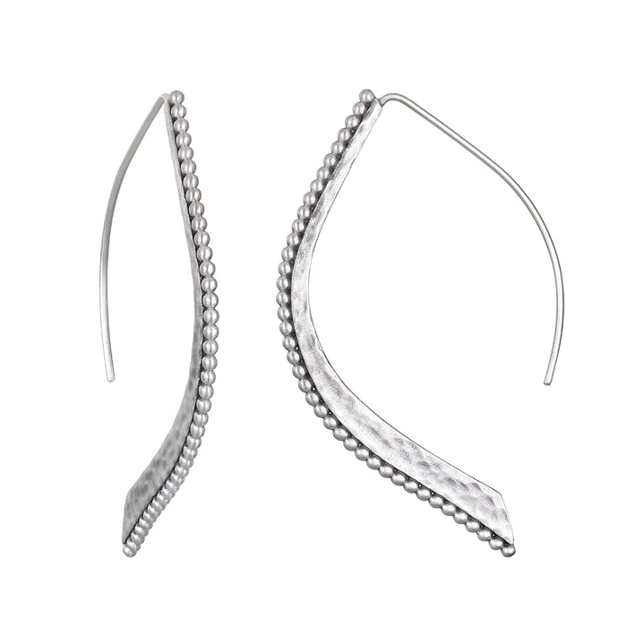 Embody Grace Lotus Petal Silver Earrings showcasing their elegant design with a unique curved shape, perfect for spiritual jewelry, meditation, and representing new beginnings. Ideal for yoga and meaningful manifestations.