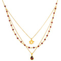 Embrace Change Garnet Lotus Triple Necklace displayed on a white background, showcasing its elegant design with garnet beads and a lotus pendant. This spiritual jewelry piece embodies the themes of transformation and renewal, making it perfect for meditation and manifestation practices. Ideal for those who seek meaningful connections in their spiritual journey.