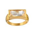 Eternal Radiance White Topaz Ring featuring a brilliant faceted white topaz on an 18kt gold plated band. This spiritual jewelry piece embodies individuality and creativity, perfect for meditation and as a talisman. Its design is meaningful for those seeking protection and alignment with the sun and moon energies, making it ideal for yoga practitioners and those focused on manifestation.