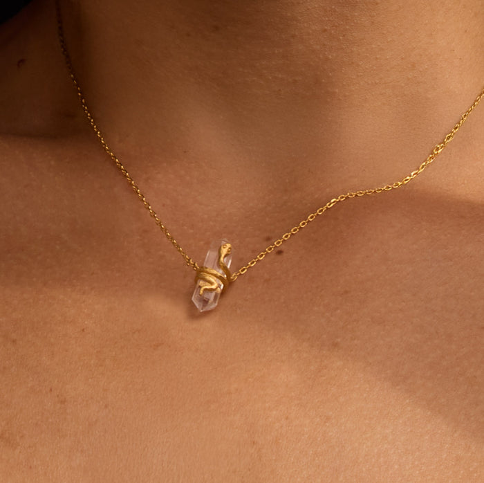 Close-up of the Eternal Spirit Clear Quartz Snake Necklace, showcasing its essence as a spiritual talisman for protection and clarity, enriching your meditation practice and embodying the meaning of manifestation.