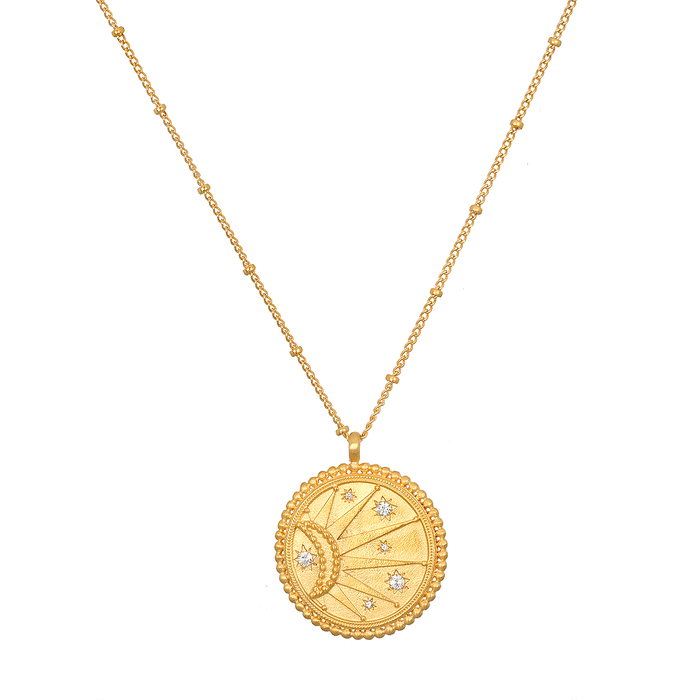 First Light Gold Medallion Reversible Pendant Necklace showcasing the coin pendant with a sun design, embodying spiritual jewelry and meaningful symbolism for vitality and leadership, making it an ideal talisman for meditation and manifestation.