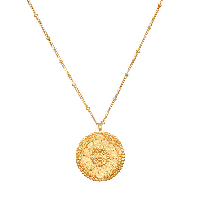 Detailed view of the sun side of the First Light Gold Medallion Reversible Pendant Necklace, representing leadership and life, ideal as a meaningful talisman for meditation and spiritual practices.