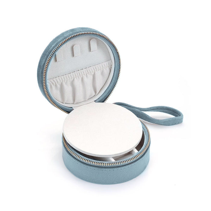 Interior of the For the Journey Travel Jewelry Case showcasing a round space for jewelry with elastic loops. This case is suitable for keeping spiritual jewelry safe, including meaningful items for yoga and meditation practices, along with talismans for protection.