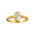 Gaining Clarity White Topaz Pear Ring showcased on a minimalist background, emphasizing its elegant pear-shaped white topaz and 18kt gold plate setting, a perfect piece for spiritual jewelry, meditation, and meaningful manifestation.
