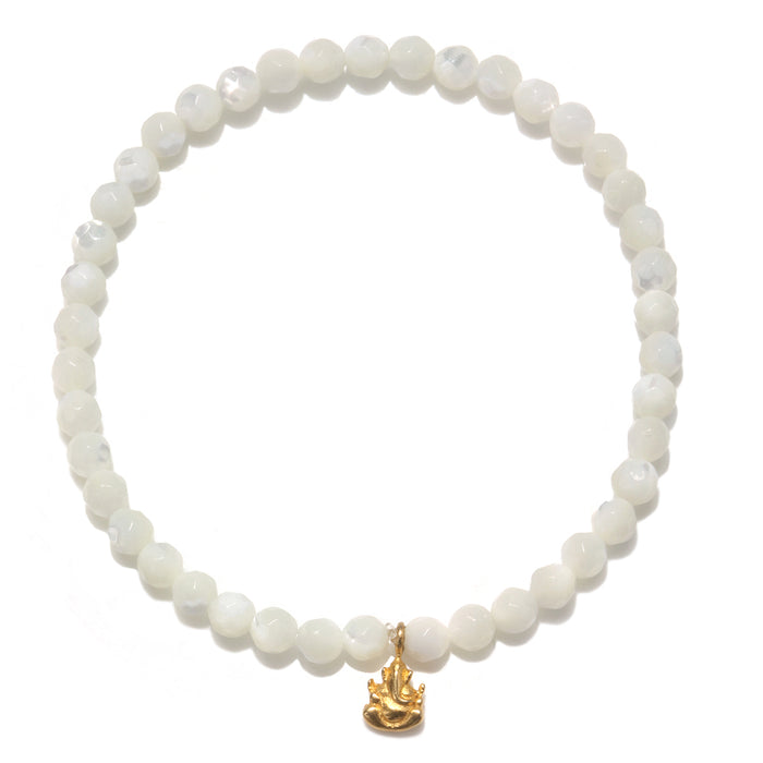 Ganesha Hindu God Pearl Gemstone Bracelet featuring mother of pearl beads and an 18kt gold plate Ganesha pendant. This spiritual jewelry piece serves as a meditation gift, embodying meaningful symbolism and protective qualities, perfect for yoga and mantra practices. Its sacred design is ideal for manifestation and carries deep meaning, making it a thoughtful zodiac amulet.