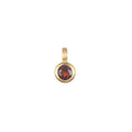 Garnet Bezel Charm in 18kt gold plate, representing love and friendship, perfect for spiritual jewelry, meditation, and as a meaningful talisman for zodiac enthusiasts. Ideal for personalizing malas or as a protective charm in yoga practices, embracing the essence of manifestation under the sun and moon.