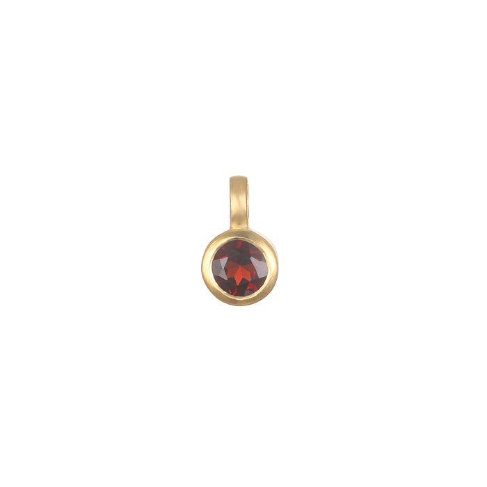 Garnet Bezel Charm in 18kt gold plate, representing love and friendship, perfect for spiritual jewelry, meditation, and as a meaningful talisman for zodiac enthusiasts. Ideal for personalizing malas or as a protective charm in yoga practices, embracing the essence of manifestation under the sun and moon.